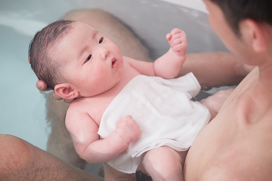 giving a newborn a bath