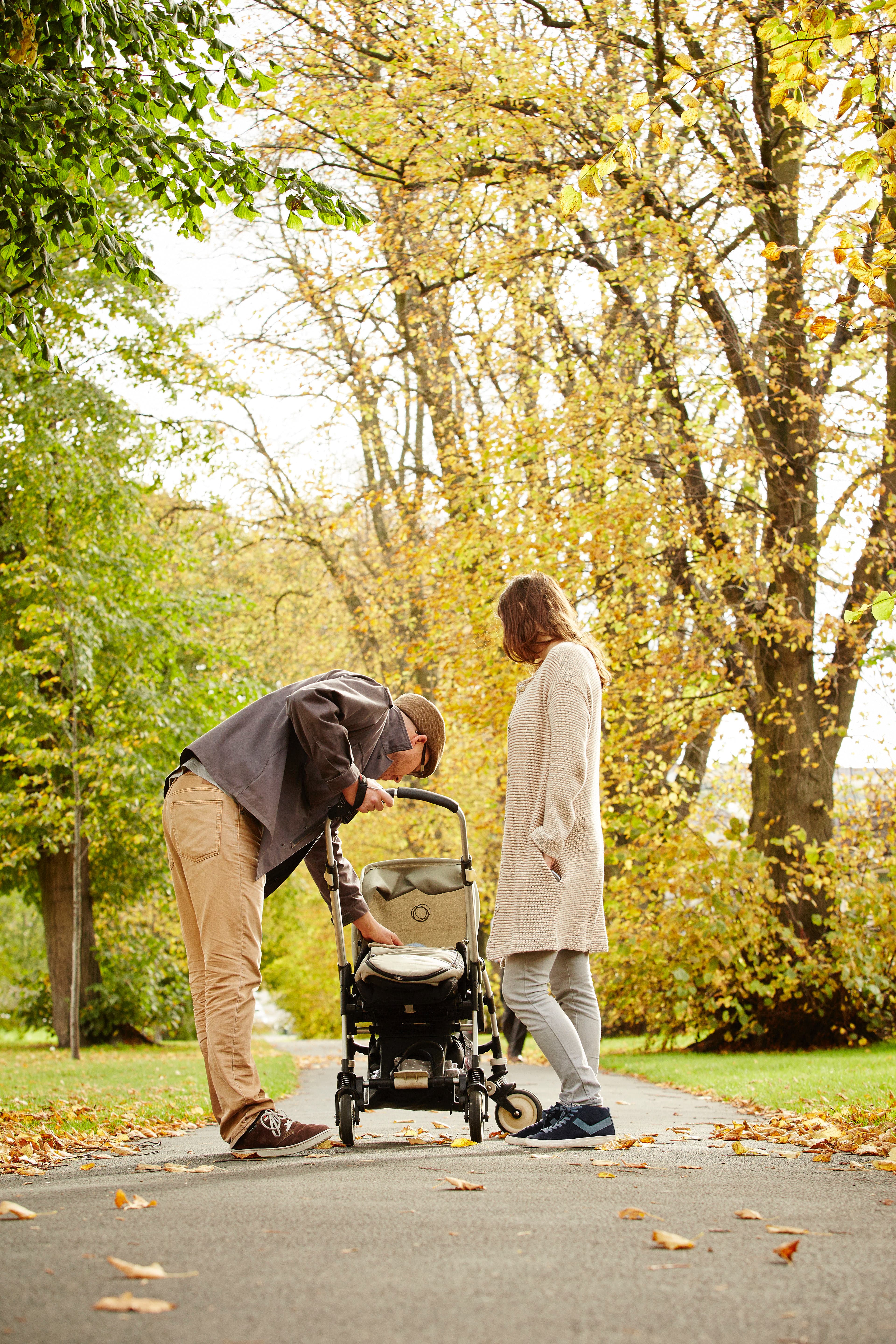 Parents with buggy in Autumn