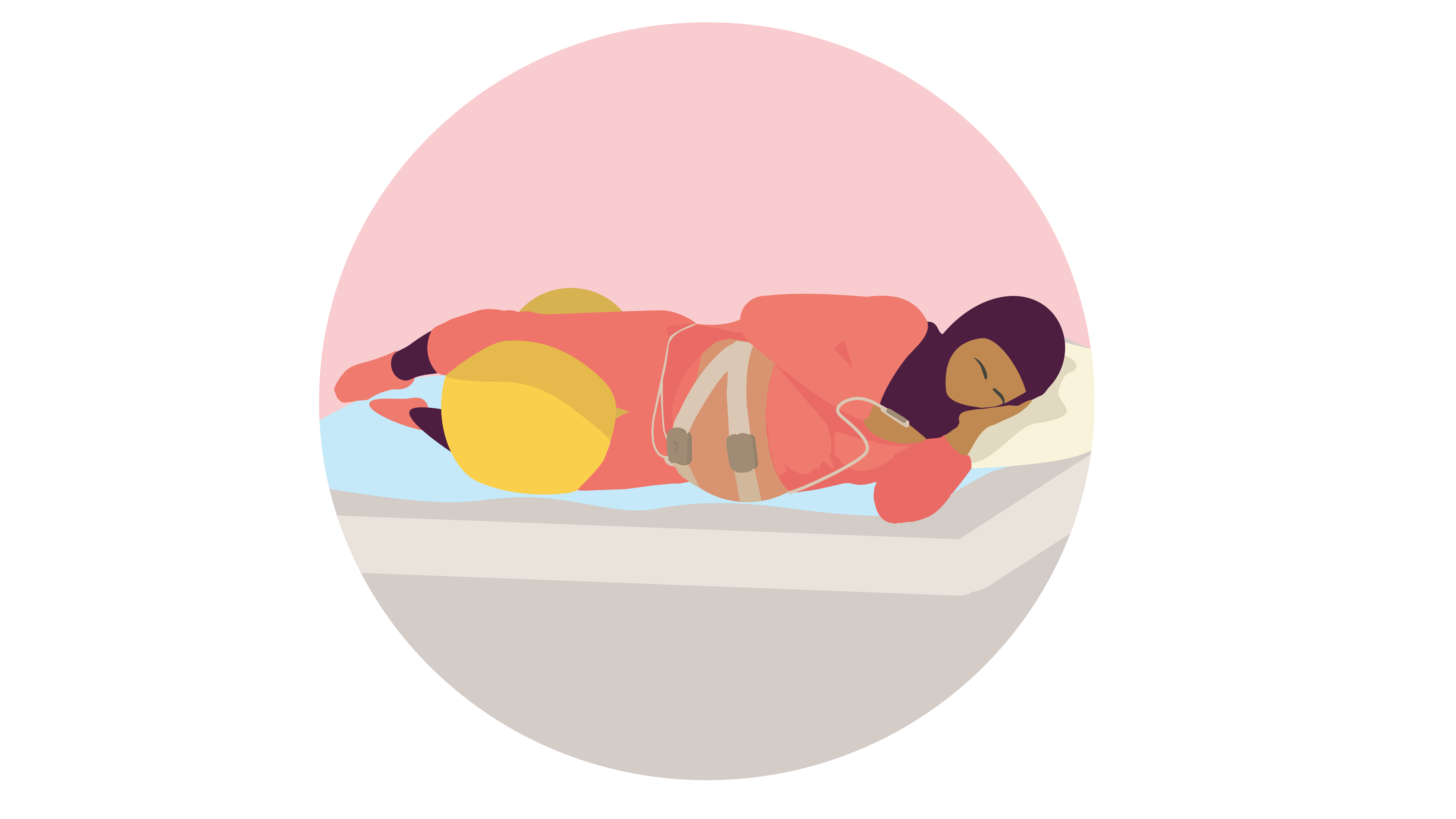 Woman or birthing person lying on a bed with a peanut ball between their legs