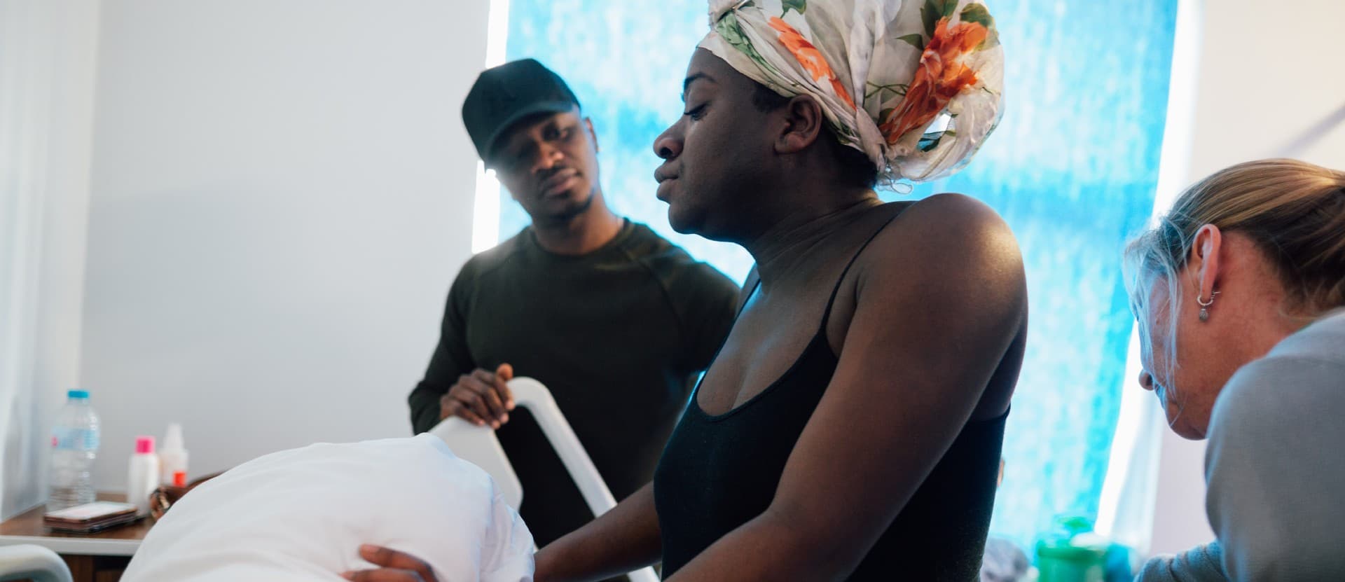 A doula helping a pregnant woman
