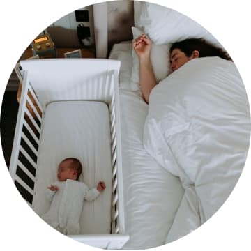 Mother and newborn sleeping