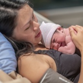 Woman having just given birth to her baby