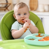 Baby eating solid food