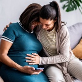 Pregnant couple feeling tummy