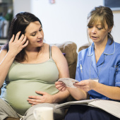 Midwife and pregnant woman or person