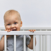 Toddler in cot