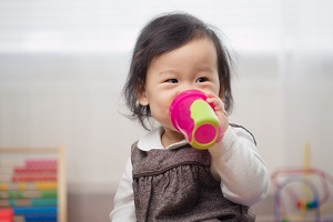 Toddler with a cup