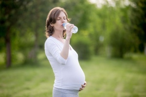 pregnant woman drinking water