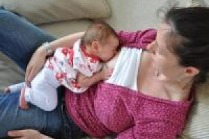 woman breastfeeding lying down