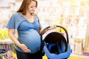 Pregnant lady buying car seat