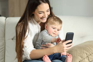 Mother on phone with baby