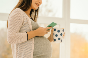 Pregnant woman texting