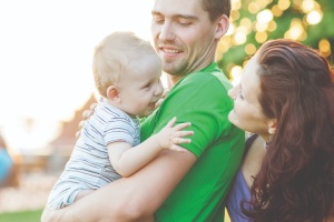 Parents holding a baby