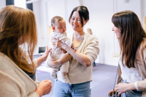 Mum with baby in a group