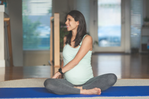 Pregnant woman practising yoga