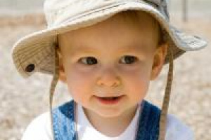 Toddler in sun hat