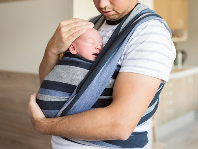 dad with baby in sling