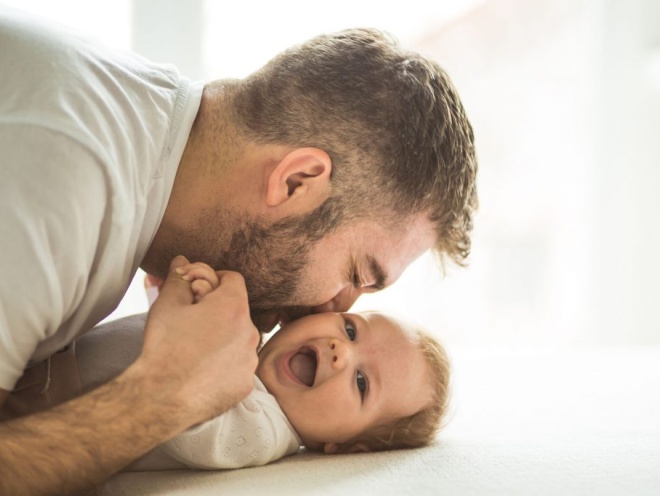 dad kissing baby