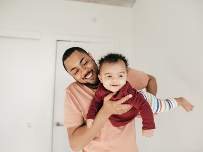 dad playing with baby