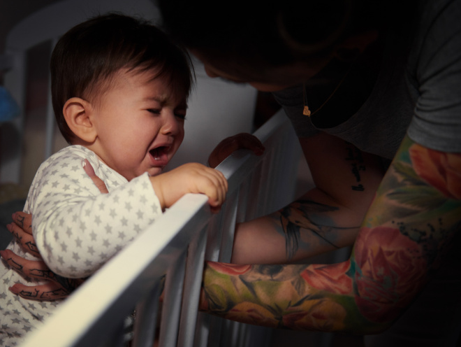 Baby crying in cot at night
