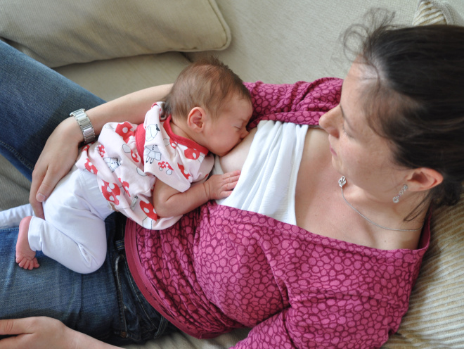 Woman breastfeeding lying down