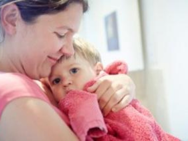 Mother holding toddler