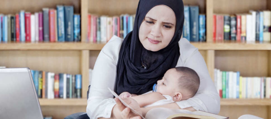 Parent studying with a baby