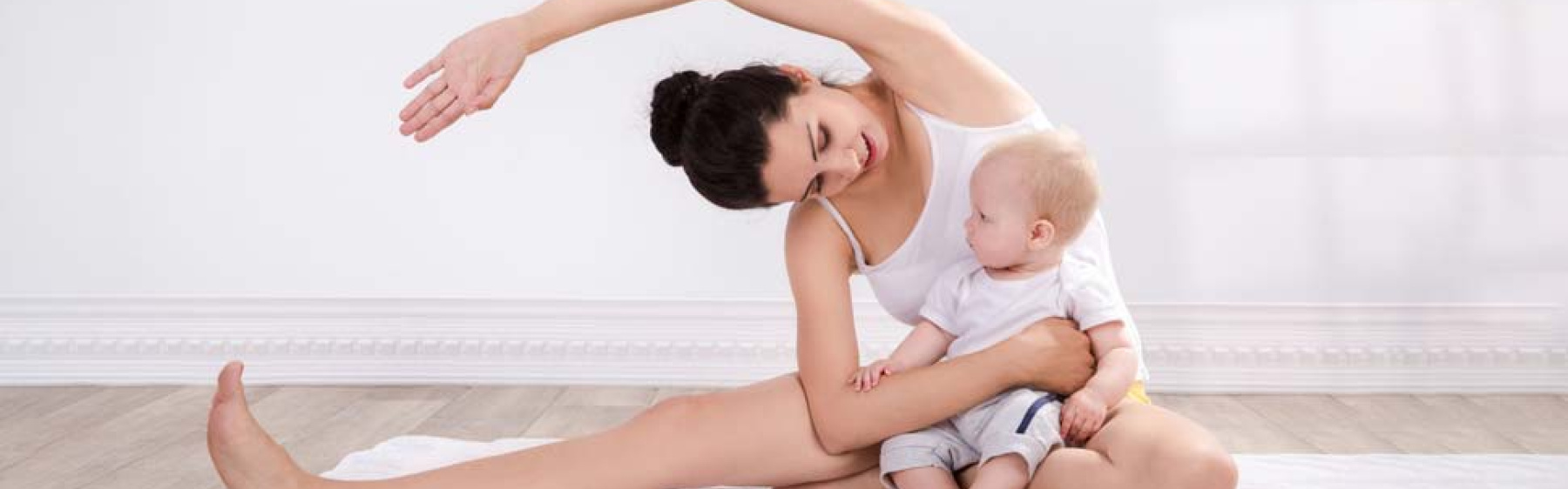 Mum doing yoga with her baby