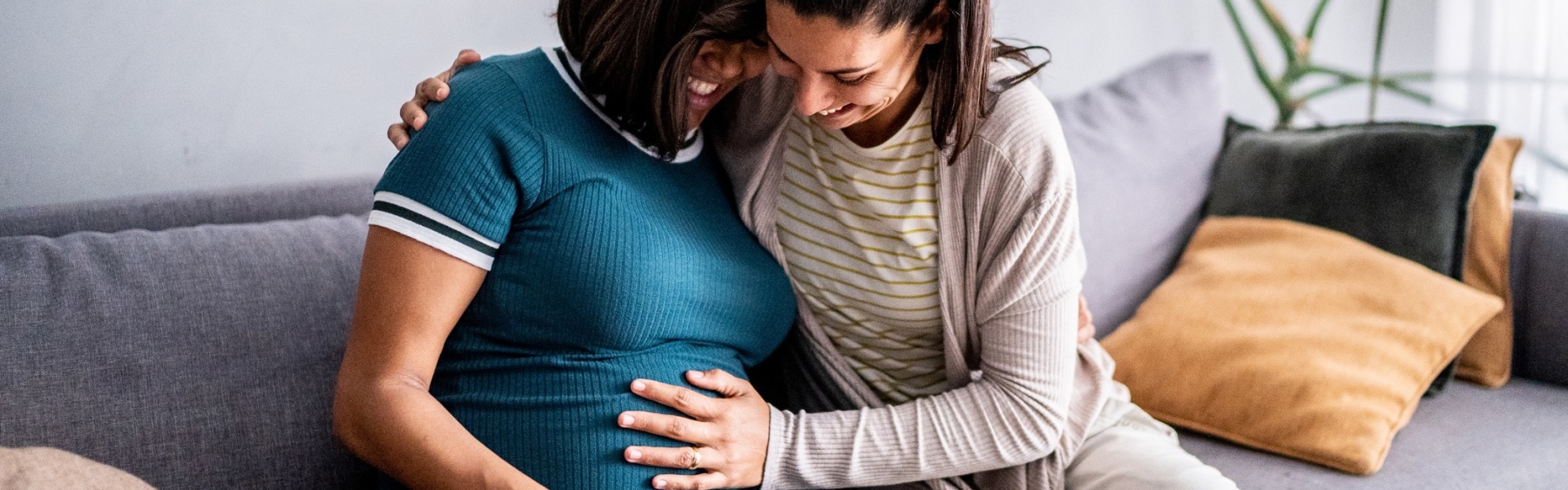 Pregnant couple feeling tummy