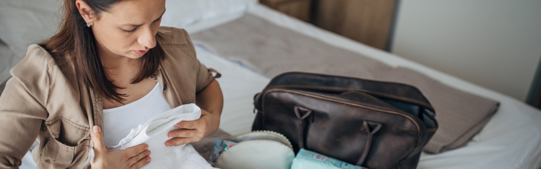 Expectant parent packing hospital bag