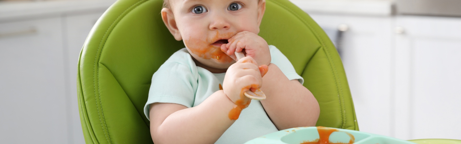 Baby eating solid food