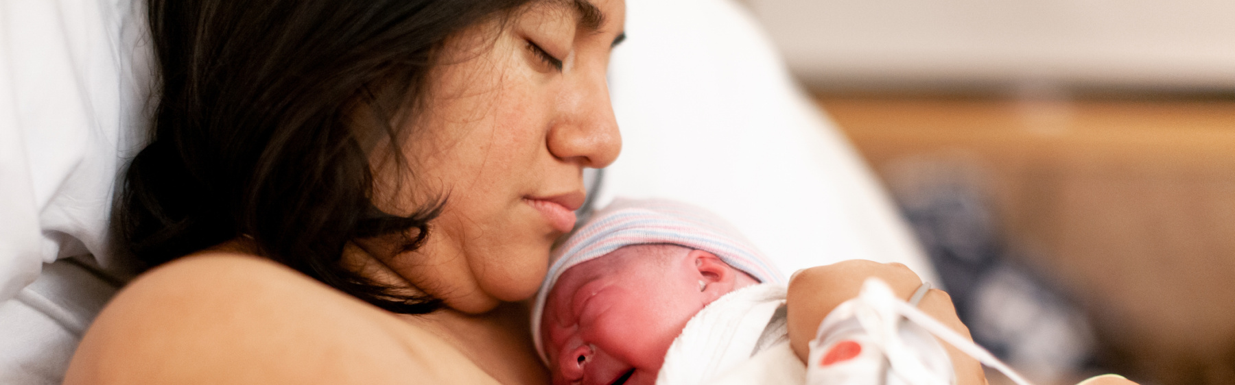 Mother or birthing person and baby