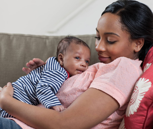 Mum with infant on couch