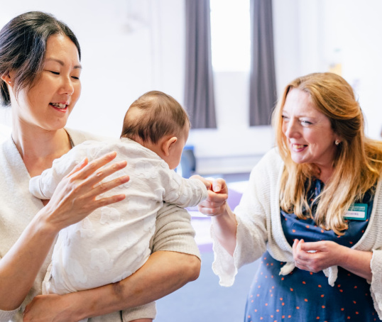 Course leader with mum and baby