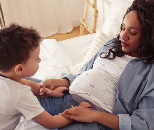 Pregnant parent with toddler