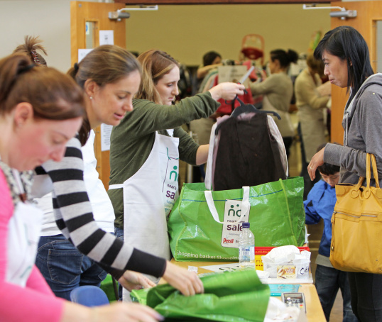 Volunteers at Nearly New Sale selling items