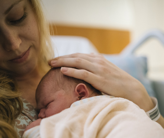 Parent with newborn baby