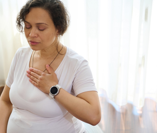 Pregnant woman or person on birthing ball