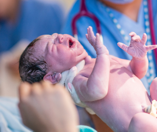 Baby being born