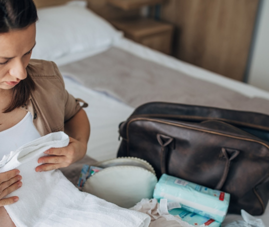 Expectant parent packing hospital bag