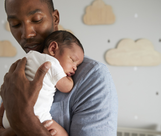 Parent holding newborn