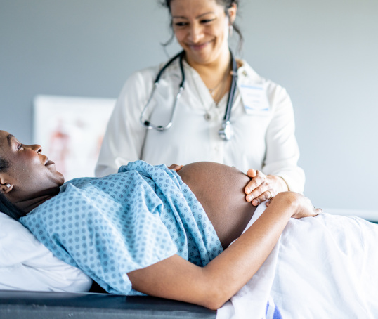 Doctor examining pregnant woman