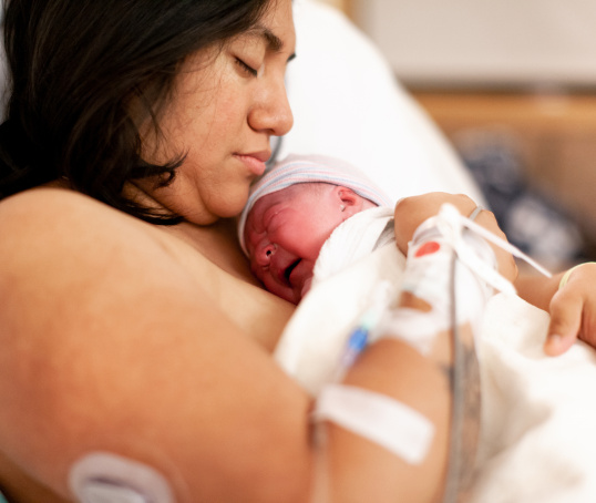 Mother or birthing person and baby