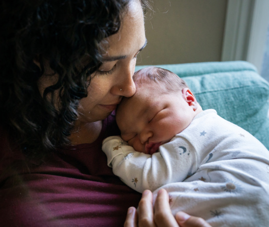 Mother holding newborn baby