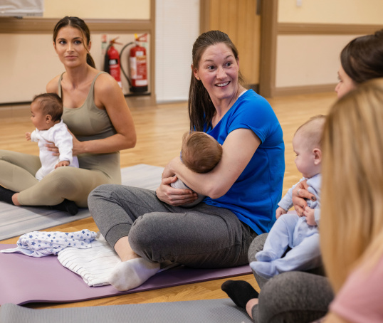 Group of mums and babies at yoga class