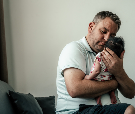 Dad holding his baby