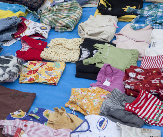 Baby clothes on a seller's table