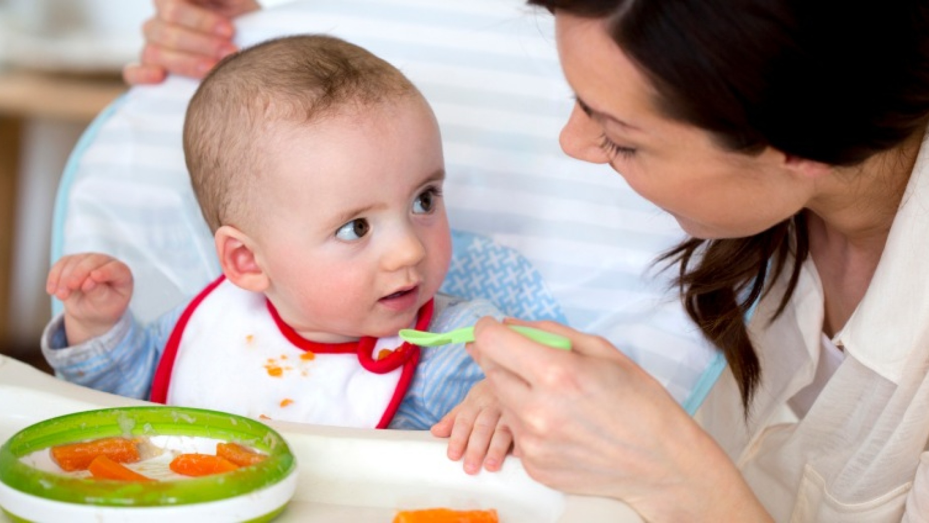 A mother feeding her baby