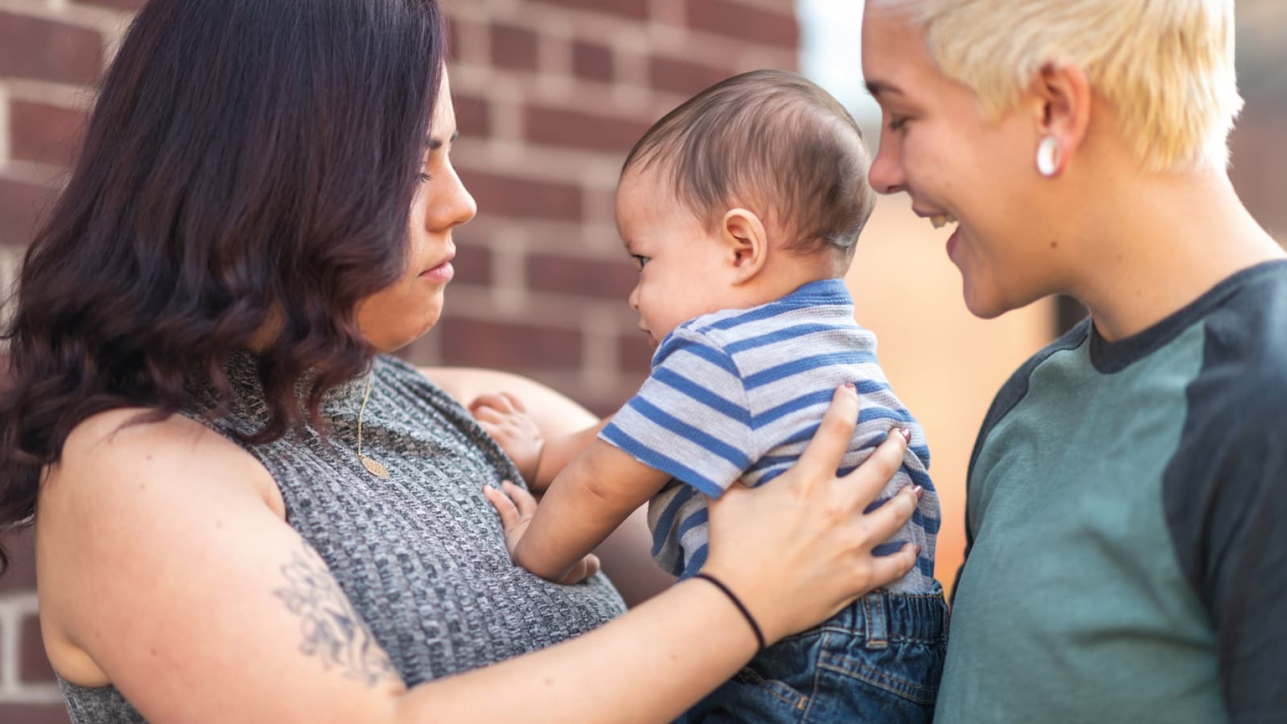 Two mums and their baby