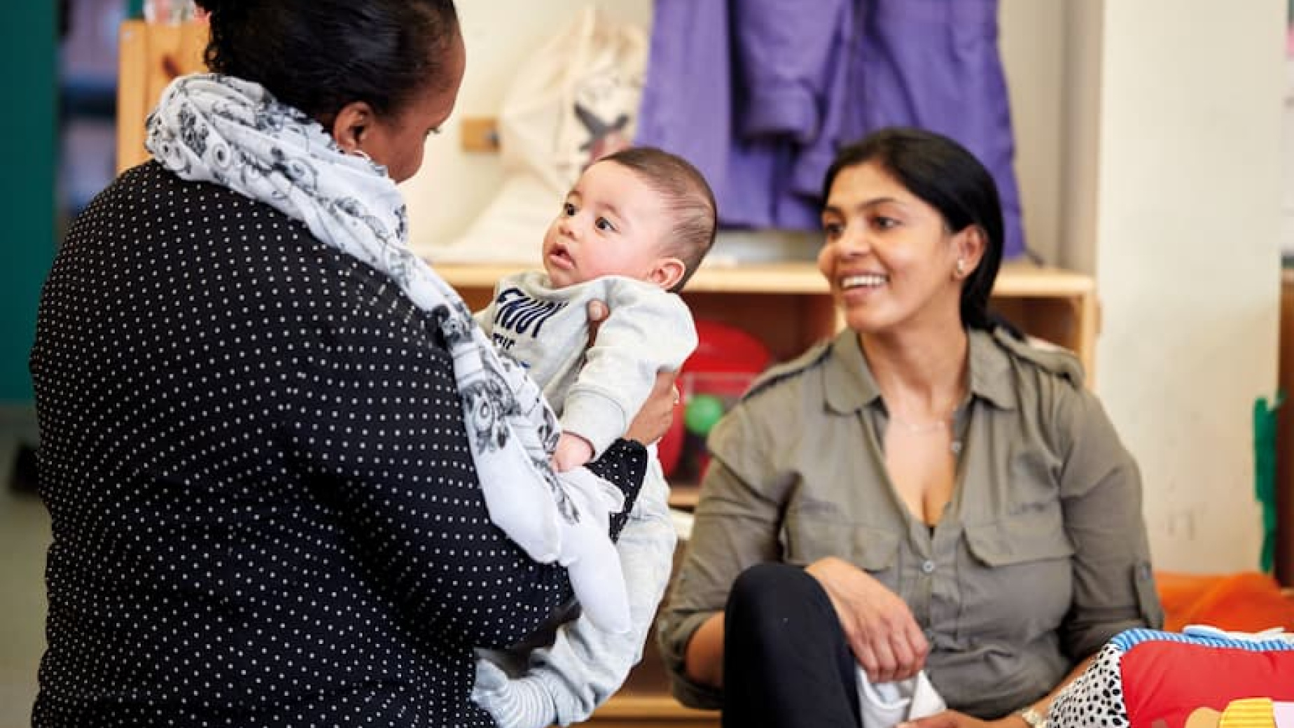 Two women and a baby at a support group